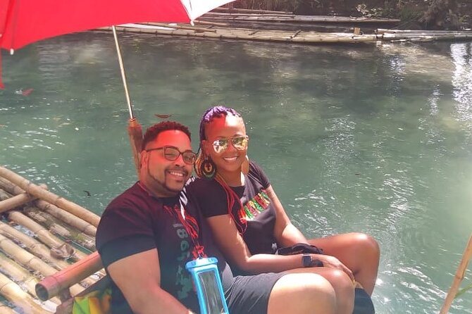 Bamboo River Rafting Experience from Ocho Rios - Boarding a bamboo raft with a local captain