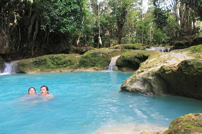 Blue Hole and Secret Falls plus Luminous Lagoon Tour - The glowing water at Glistening Waters