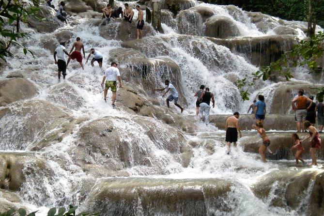 Blue Hole plus Secret Falls and Dunns River Falls Combo from Runaway Bay Hotels - Dunn’s River Falls turns a waterfall into a group climb