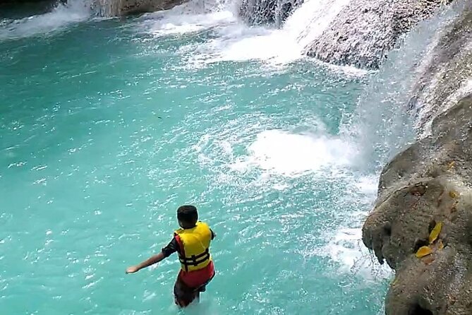 Dunns River Falls & Blue Hole Combo from Montego Bay with Pick Up - A Jamaican jerk stop, with lunch details to confirm