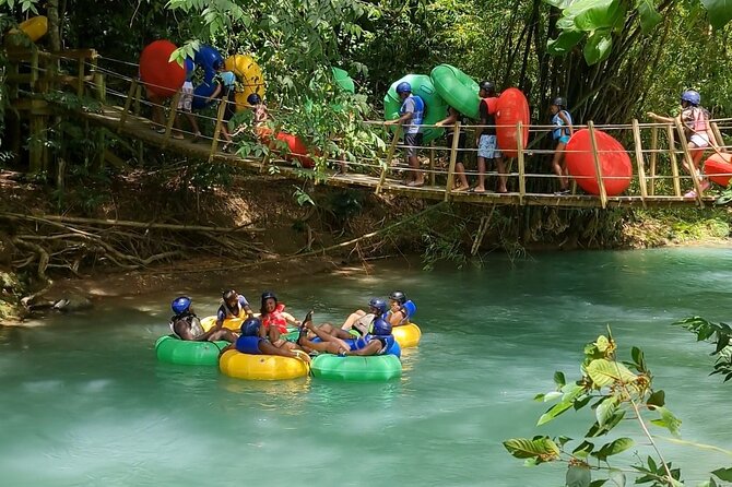 Falmouth Waterfalls River Tubing and Beach Adventure - Tubing the Rio Bueno Through Light Rapids
