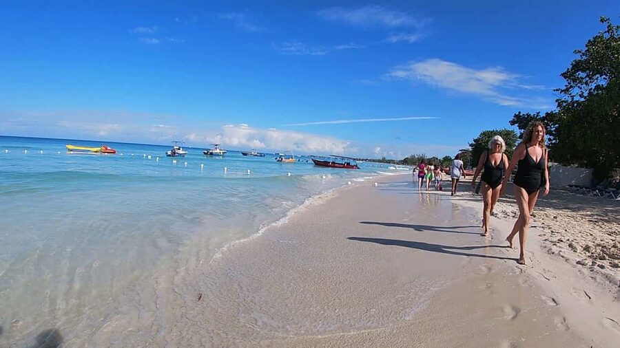 From Montego Bay: Negril Beach & Rick's Cafe Sunset Day Trip - Margaritaville adds comfort, food, and a social mood