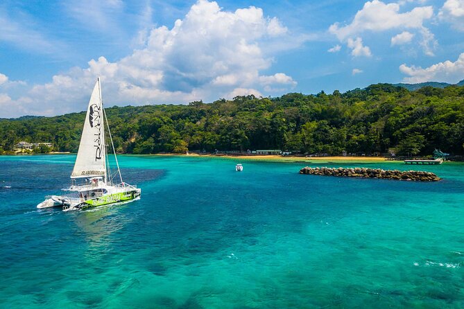 Lovers Rock Catamaran Cruise From Ocho Rios - Open bar, fruit, pastries, and small bites