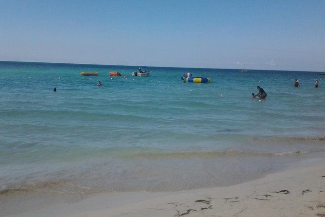 Montego Bay Excursion Negril 7 Miles Beach, Rick's Cafe and Time Square Shopping - The guide and group experience