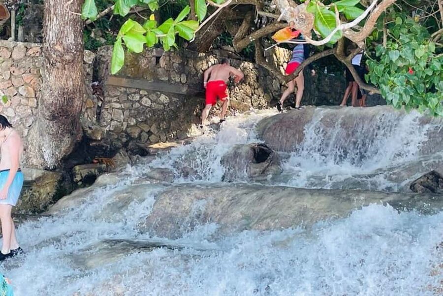 Montego Bay: Private Dunn's River Falls and Blue Hole Tour - Leaving Montego Bay in an air-conditioned vehicle