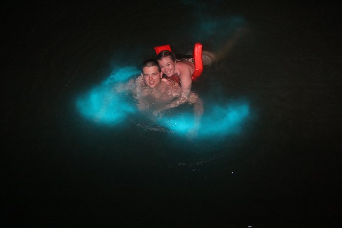 Mystic Luminescent Lagoon Night Cruise & Swim in Jamaica - Swimming through the glow
