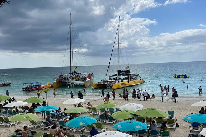 Negril Private Day Tour: ATV Ride, Party Catamaran & Ricks Cafe - Seven Mile Beach and the handoff to the catamaran