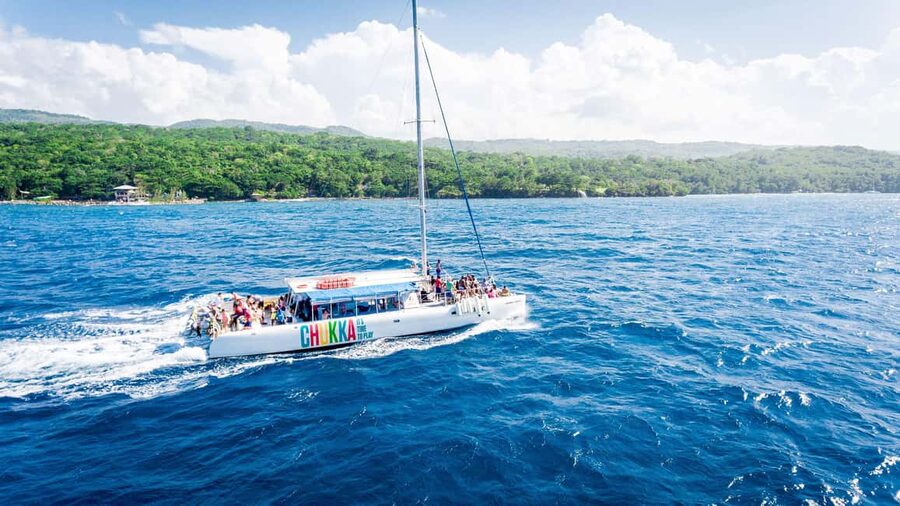 Ocho Rios: Catamaran Sail & Snorkel + Dunn's River Climb - Sailing the Ocho Rios coast with the catamaran crew