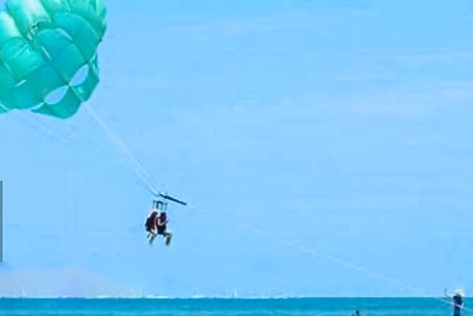 Parasailing above Turquoise Ocean Waters in Montego Bay - Taking off above Montego Bay’s turquoise water