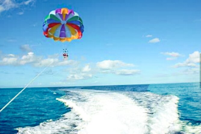 Parasailing above Turquoise Ocean Waters in Montego Bay - The water-sports staff and group experience