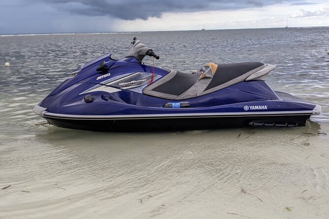 Parasailing, Sea Tubing & Jet Ski from Montego Bay- Private tour - Holding on during the sea-tube ride
