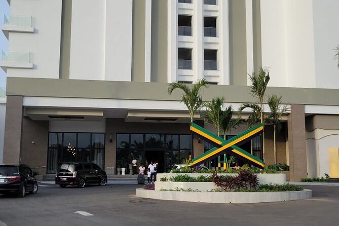 Private Airport Transfer Riu Aquarelle & Excellence Oyster Bay - The Falmouth sign and personalized stops