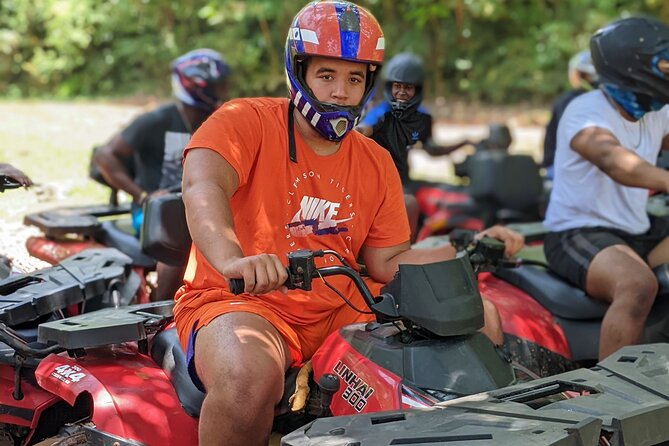 Private ATV Ride 7 Mile Beach & Rick’s Café Negril Tour - Jerk chicken in an open-air setting