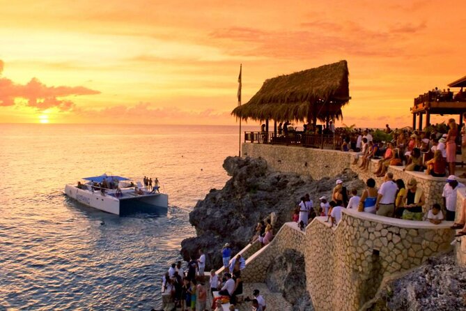 Private Trip to Blue Hole Mineral Springs, Negril & Ricks Café - Negril’s seven-mile beach and Margaritaville