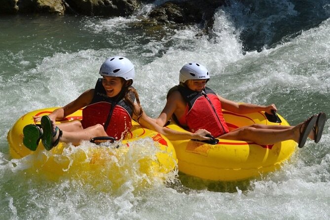 River Rapids Tubing and Beach Visit with Private Transportation - A short swim and a chance to jump
