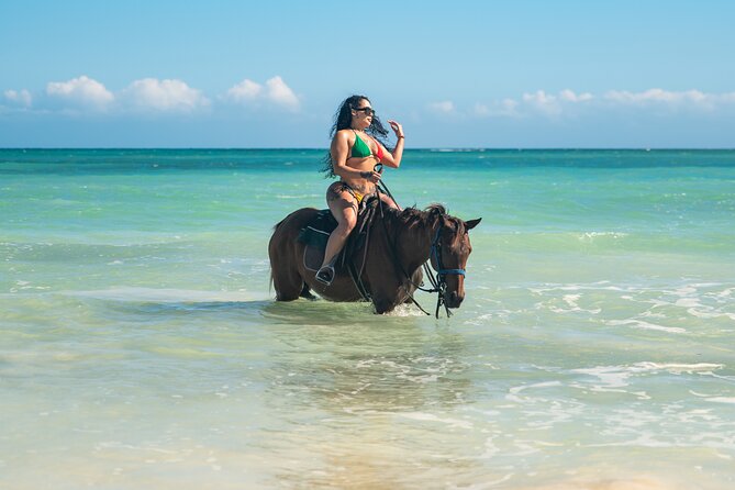 Zipline, Dunn’s River Falls, Bamboo Rafting & Horseback Ride Tour - Horseback riding and swimming in St. Ann’s Bay